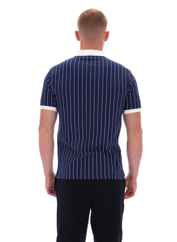 Man wearing a navy pinstripe shirt with white trim on a white background