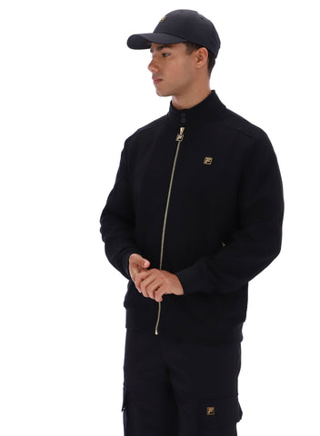 Man wearing a black jacket and cap on a white background