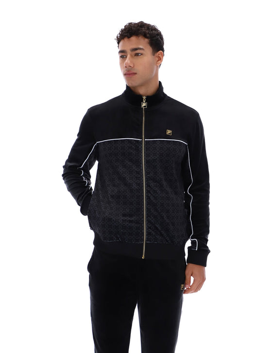 Man wearing a black tracksuit with white accents on a white background