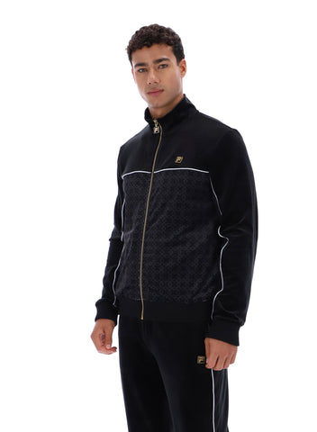 Man wearing a black tracksuit with white piping on a white background