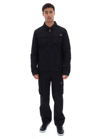 Man wearing a black jacket and pants on a white background