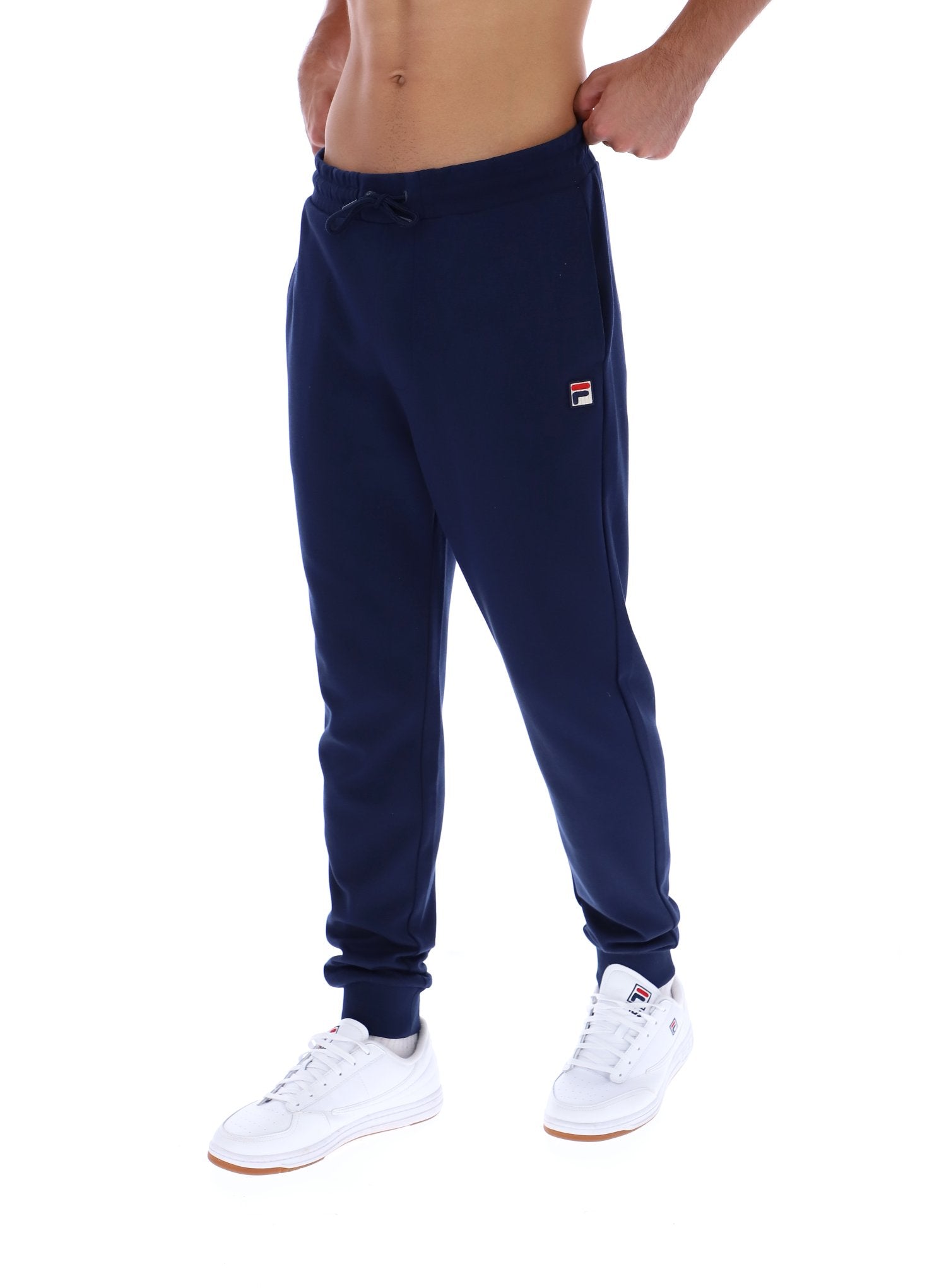 Navy blue sweatpants with a brand logo worn by a person on a white background
