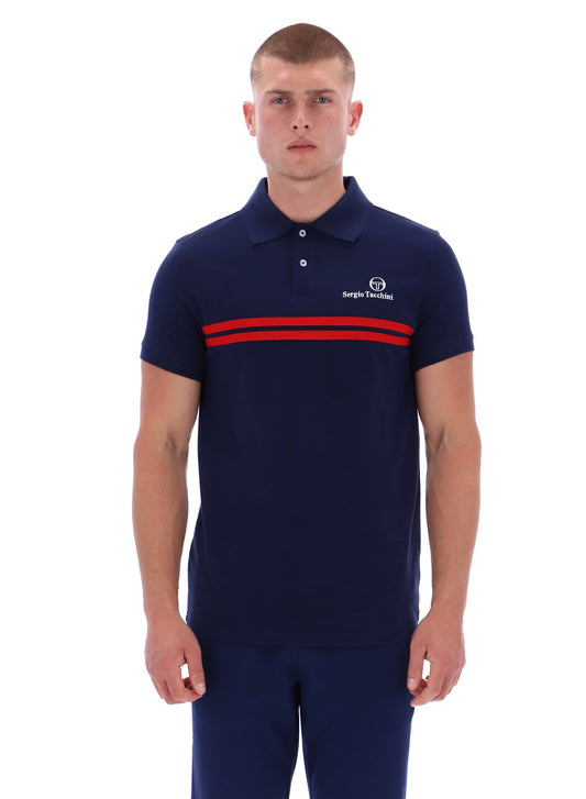 Man wearing a navy polo shirt with red stripes and a logo on a white background