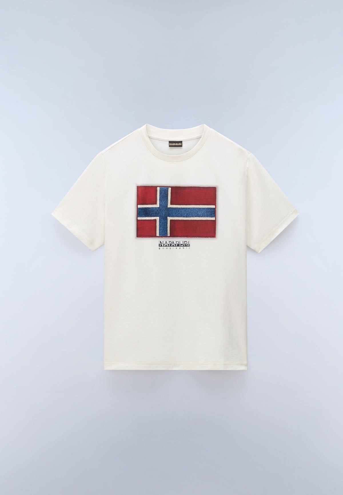 White t-shirt with a flag design on a light gray background