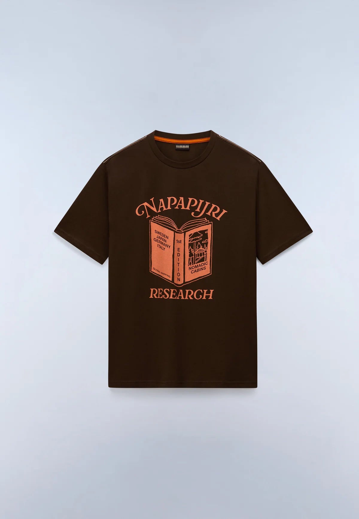 A dark brown short-sleeve t-shirt with a graphic print of an open book and the words 'NAPAPJIRI RESEARCH' in orange, displayed on a light gray background.
