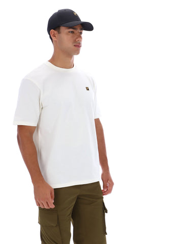 Man wearing white t-short, khaki trousers, and a black baseball cap on a white background
