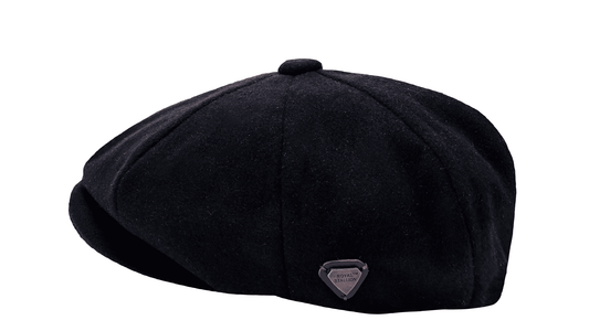 Black flat cap on a white background