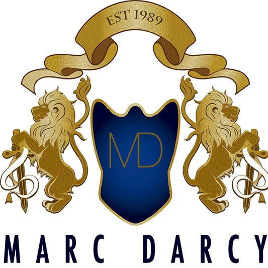 Logo of Marc Darcy with gold lions and a blue shield on a white background