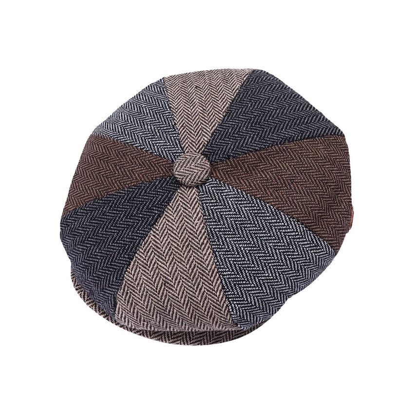 Herringbone patterned flat cap on a white background