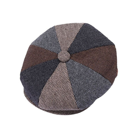 Herringbone patterned flat cap on a white background